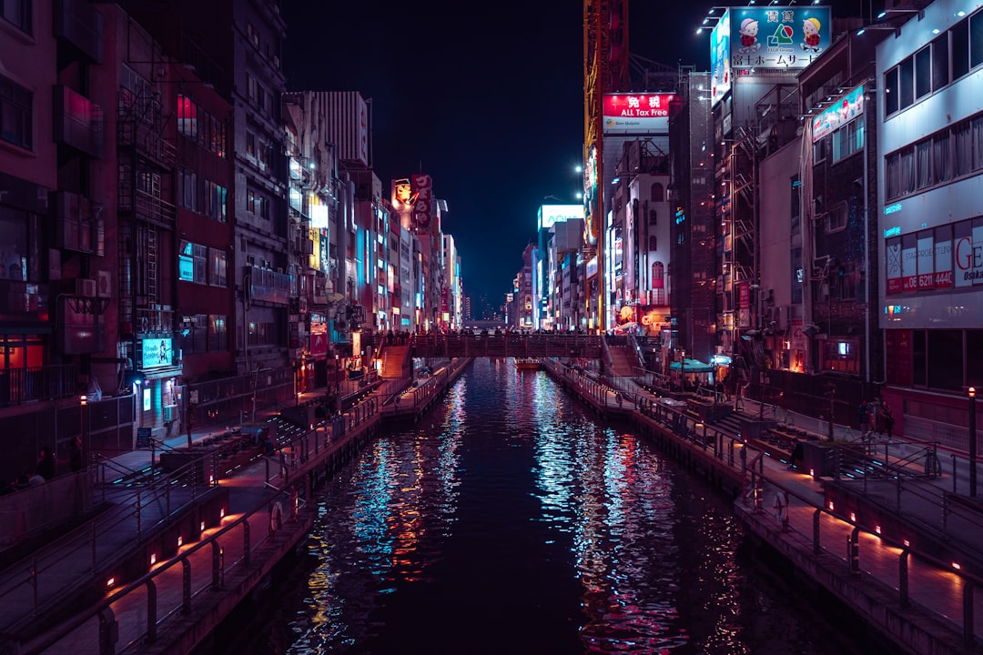A river running through a city next to tall buildings