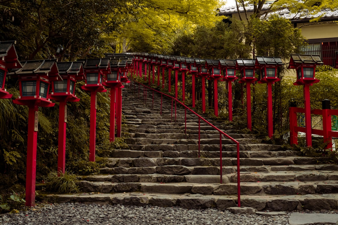 Red lanterns line the stone steps.