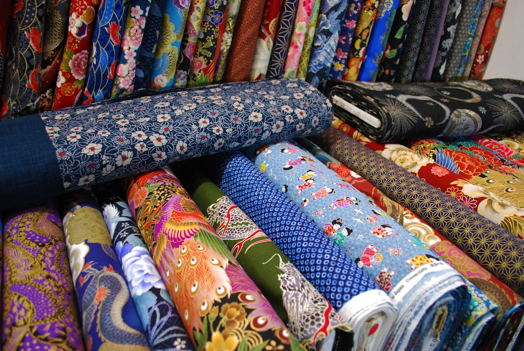 a bunch of different colored ties are on display