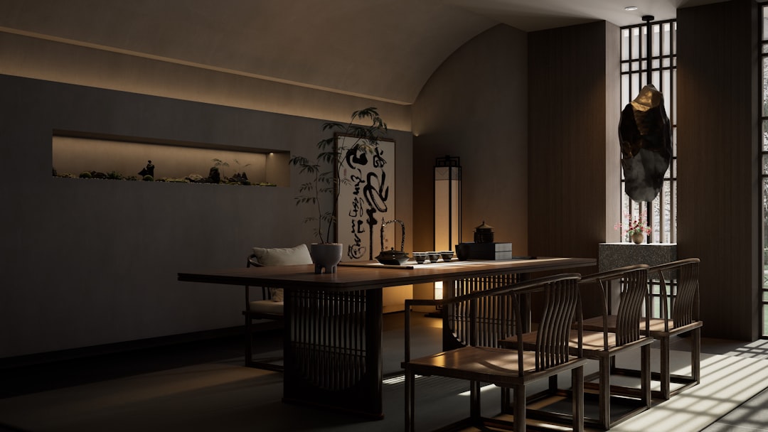 Elegant room with a long wooden table and chairs.