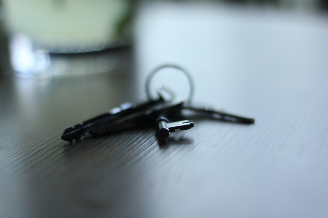 a pair of scissors sitting on top of a wooden table