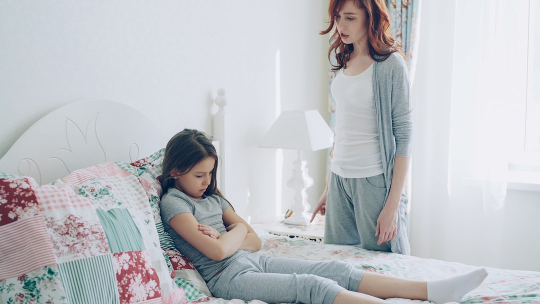 A mother confronts her child, who is upset.
