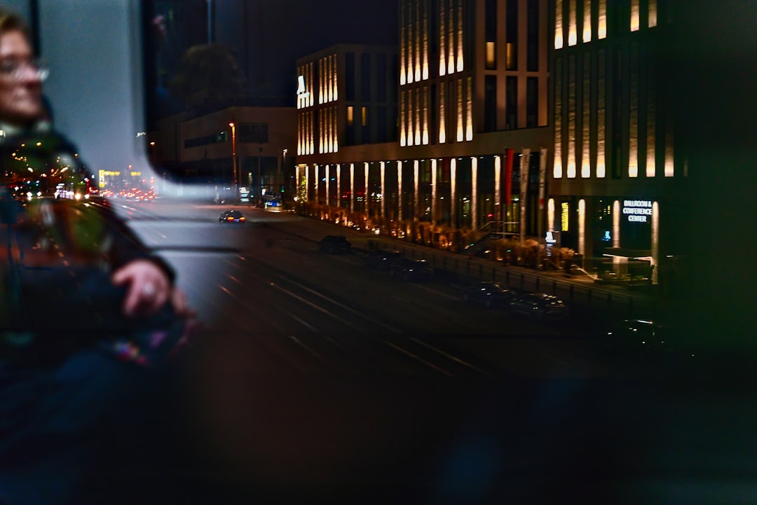 Modern buildings illuminated at night with blurred motion.