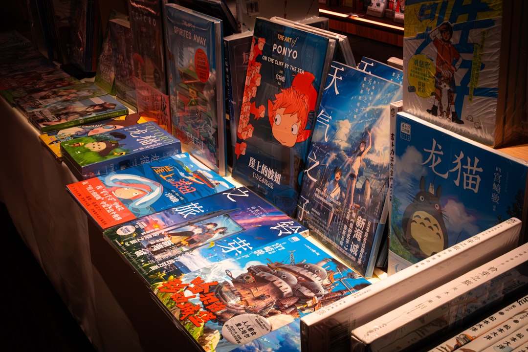 Various books and dvds displayed on a table.