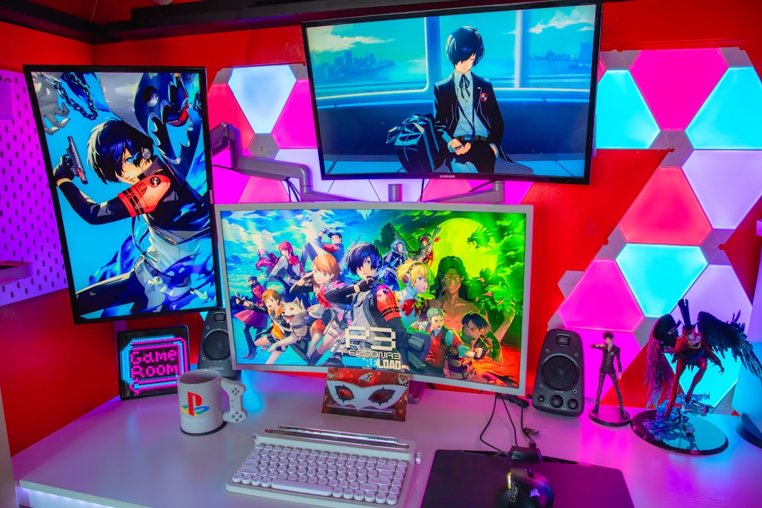 a desk topped with three computer monitors and a keyboard