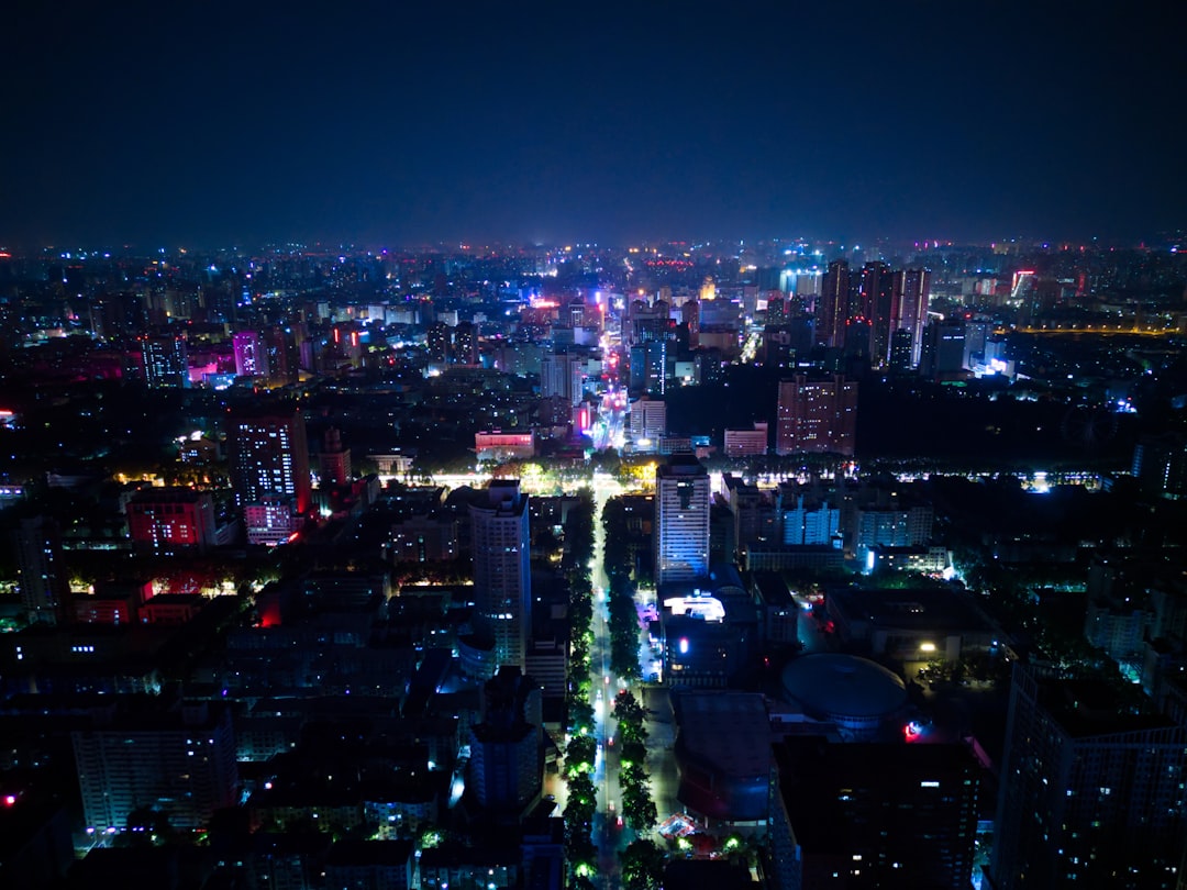 a view of a city at night from the top of a building